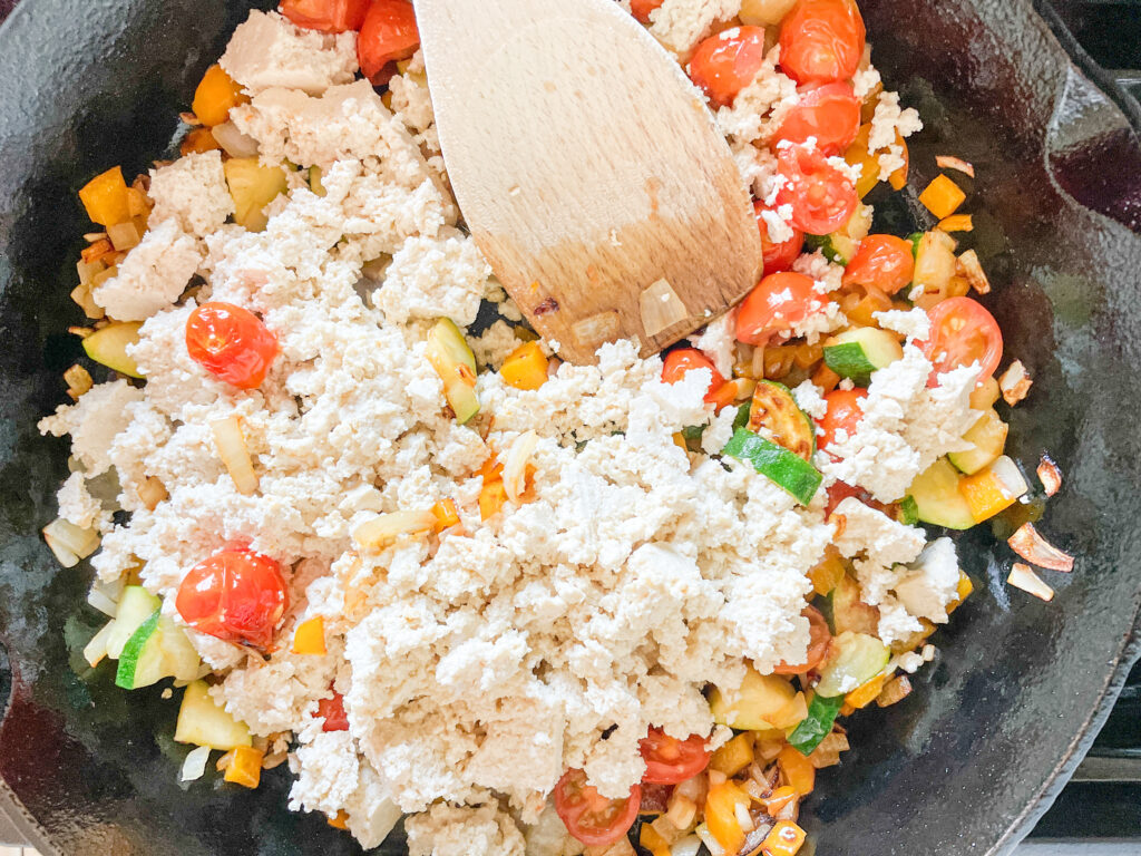 10-Minute Quinoa Tofu Veggie Scramble (Extra Protein) Tofu and Vegetables in a skillet