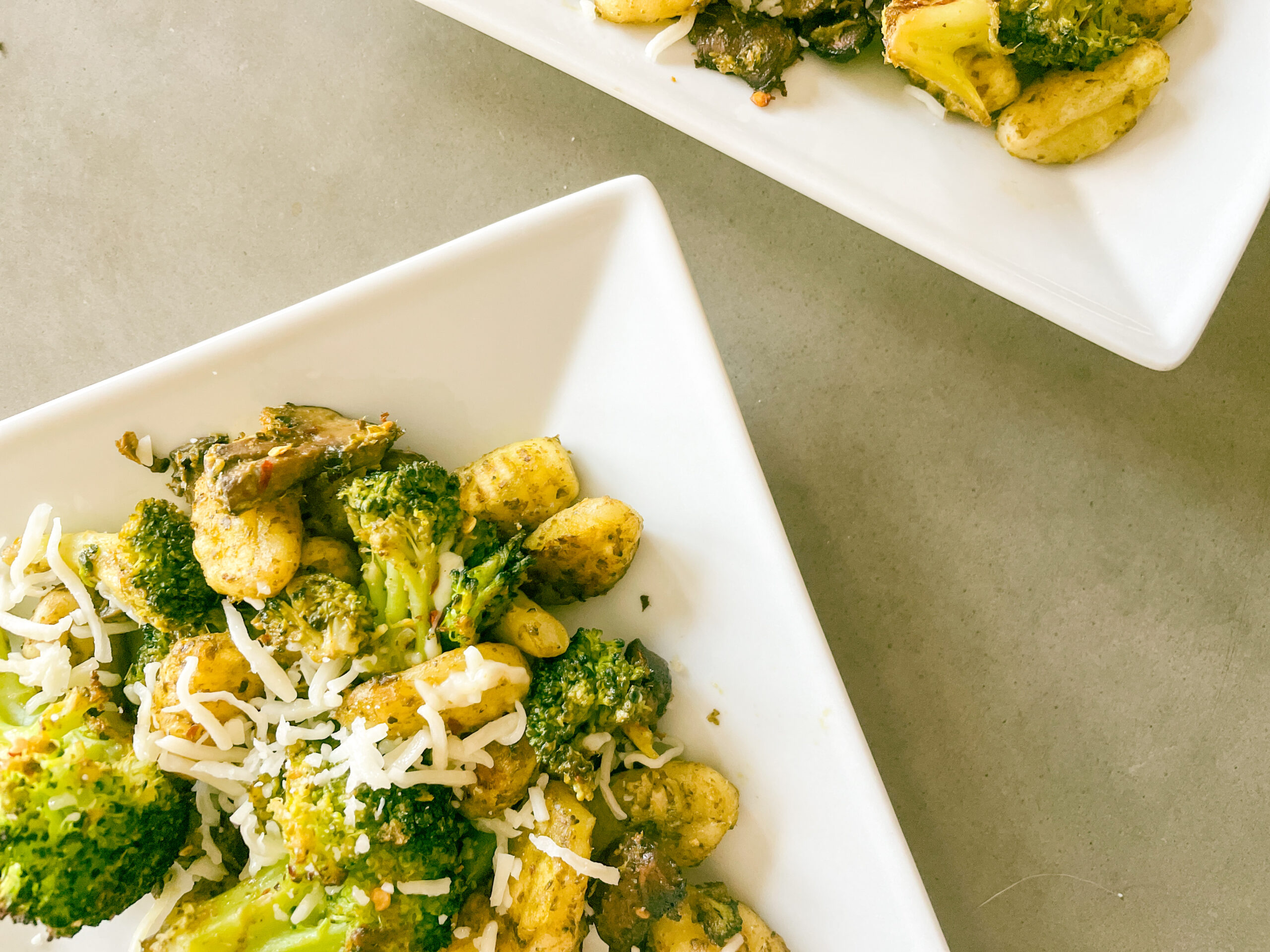 Gnocchi with broccoli, pesto and mushrooms.