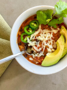 Qdoba Tortilla Soup Recipe with avocado and jalapeno peppers, cilantro