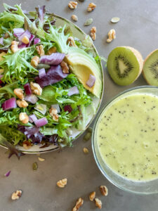 spring mix salad with walnuts and pepitas, kiwi vinaigrette salad dressing