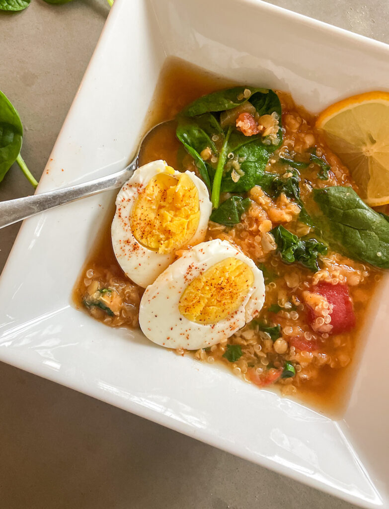 panera lentil quinoa bowl recipe with boiled eggs, spoon and a lemon slice