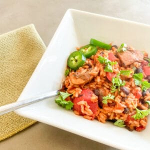 Vegetarian Black Bean Jambalaya with a fork and napkin