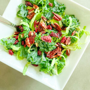 Cracker Barrel Kale Salad Recipe, salad with kale, craisons, pecans, Brussels sprouts, and maple vinaigrette dressing